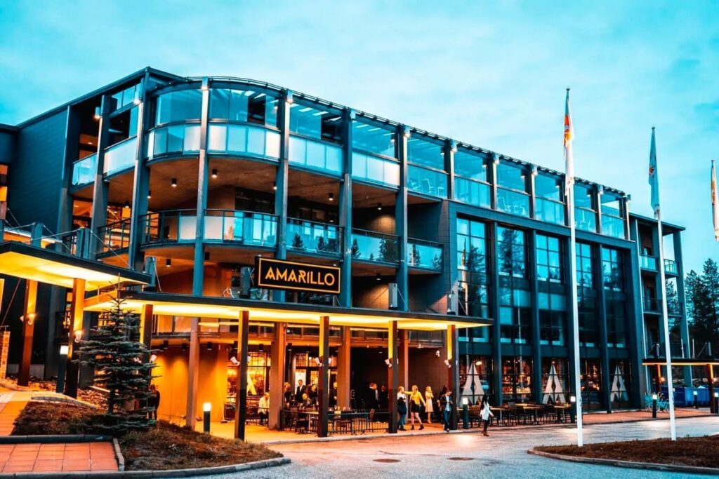 Modern accommodation building in Vuokatti at dusk