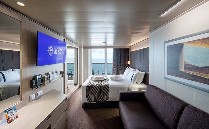 Deluxe Balcony Aurea cabin aboard MSC World Europa