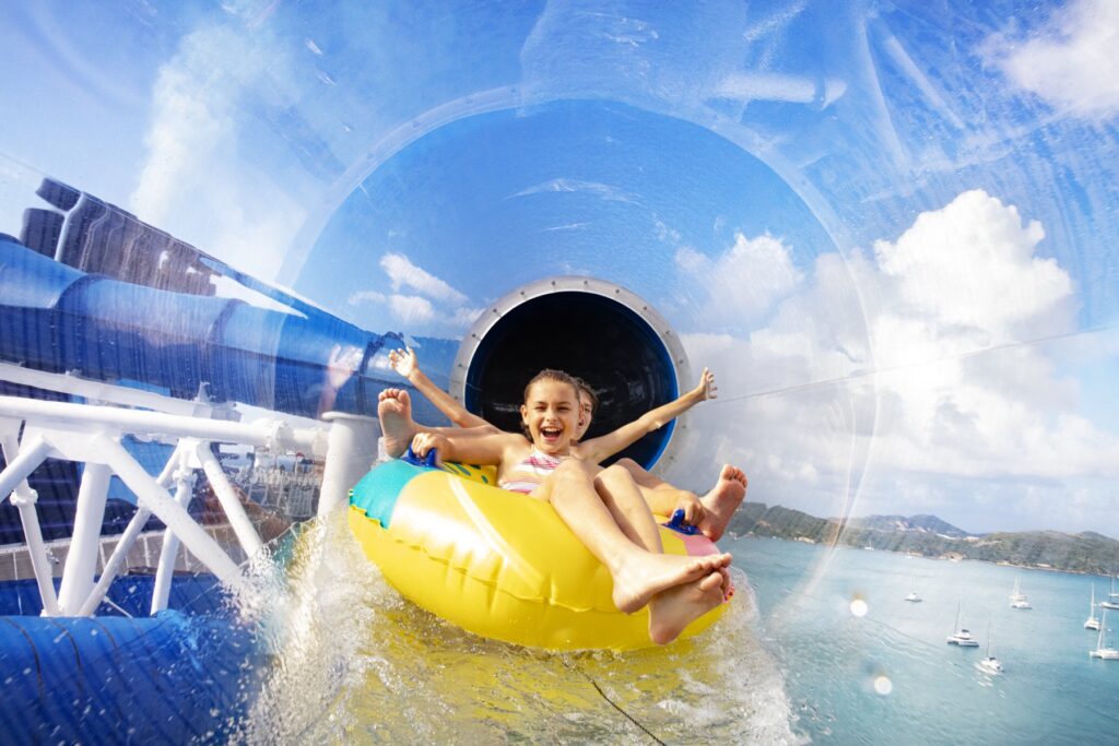 Children enjoying a waterslide aboard a Norwegian Cruise Line ship